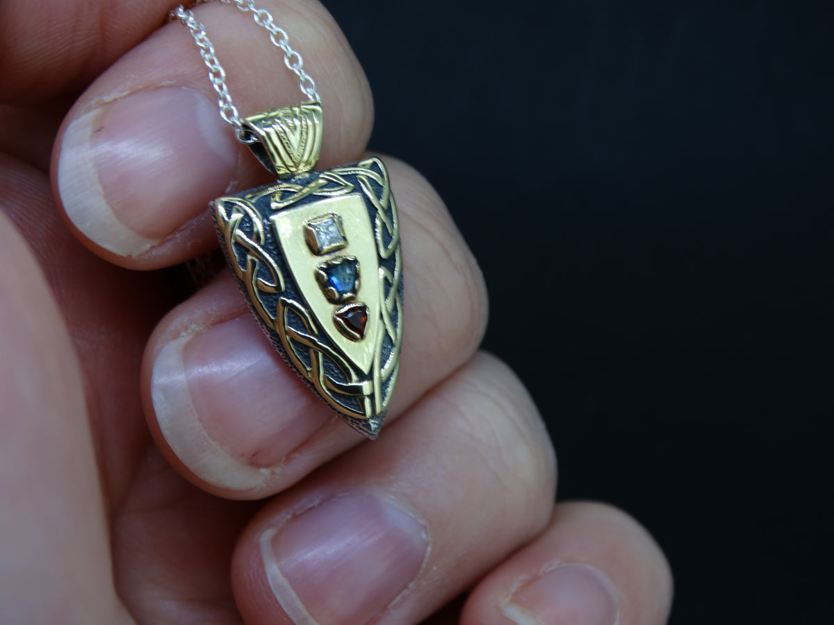 Fancy Trillion Scottish Sapphire, Elie Ruby and Diamond Pendant image 1