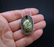 'Eilean Naomh' Iona Marble & Tourmaline, on a Scottish Gold & Silver Pendant