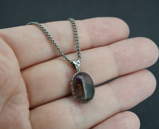 Melody's Stone Super Seven Sterling Silver Oval Hammered Celtic Pendant