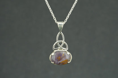 Melody's Stone Super Seven Sterling Silver Celtic Oval Pendant