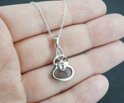 Melody's Stone Super Seven Sterling Silver Celtic Oval Pendant