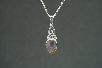 Melody's Stone Super Seven Sterling Silver Medium Knot Pendant