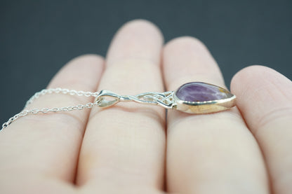 Melody's Stone Super Seven Sterling Silver Medium Knot Pendant